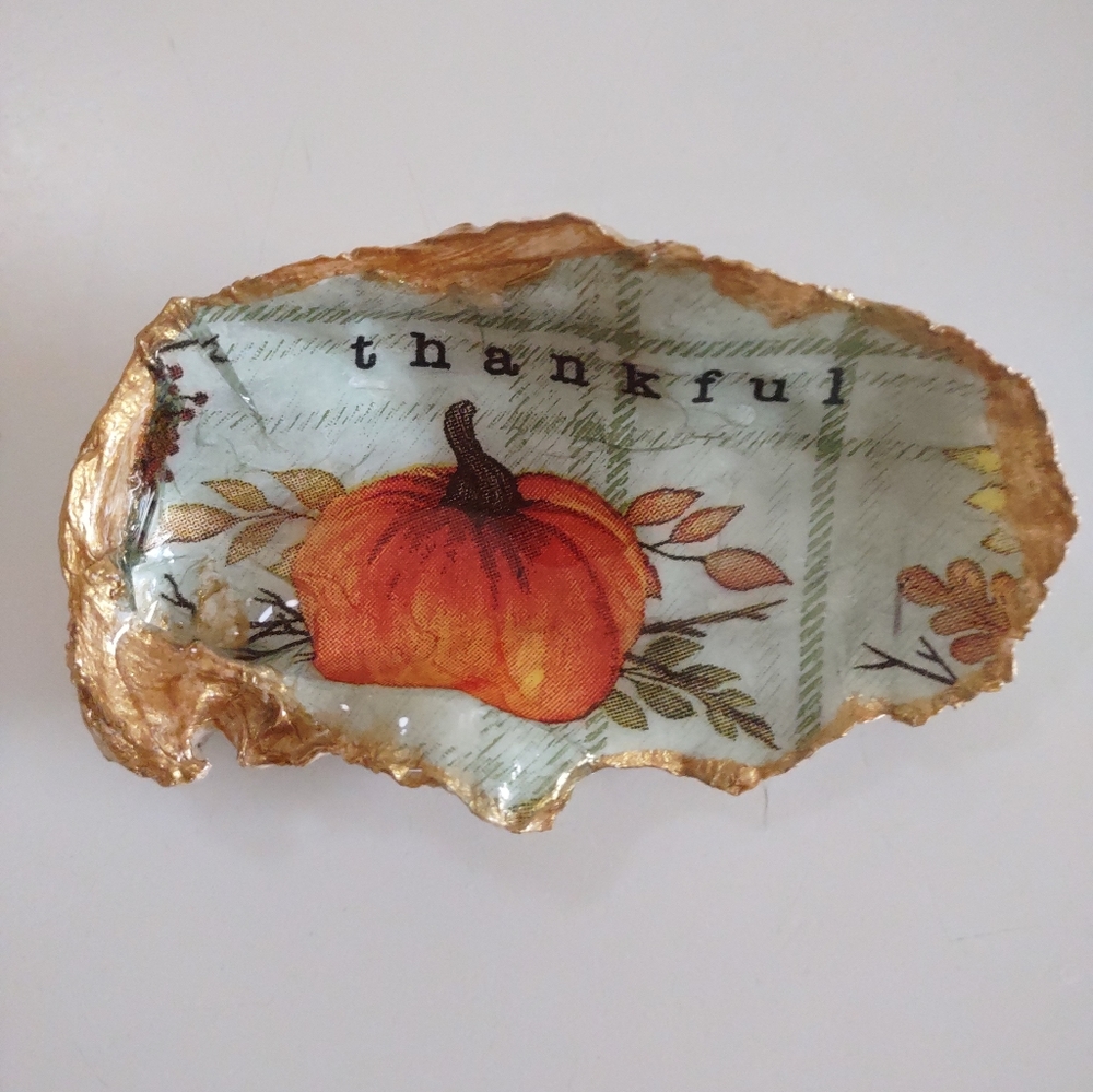 Pumpkin with thankful paper print decoupaged onto oyster shell and resin